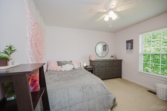 8562 Kempton Ln, Hamilton Twp, OH 45039 - carpeted bedroom with baseboards and a ceiling fan