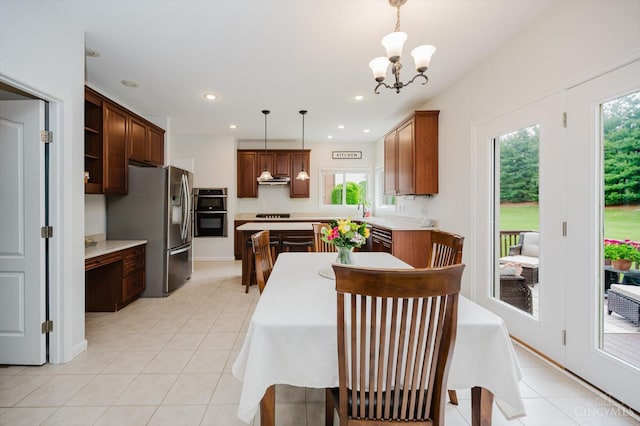8562 Kempton Ln, Hamilton Twp, OH 45039 - dining area with plenty of natural light, a chandelier, light tile patterned floors, and recessed lighting