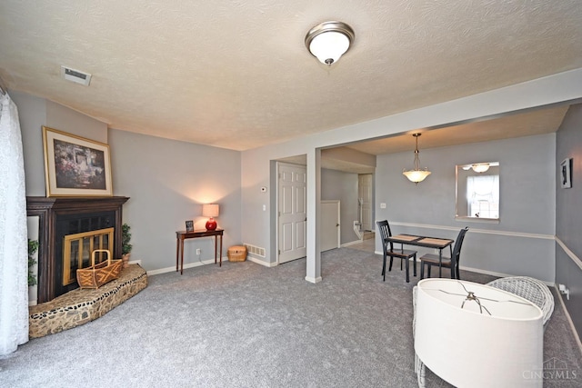 5 Spotswood Cmn, Union Twp, OH 45103 - living room with carpet, a textured ceiling, baseboards, and a glass covered fireplace