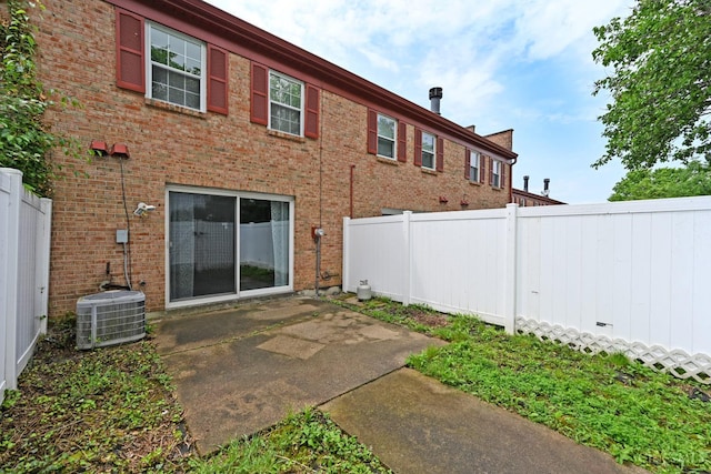 5 Spotswood Cmn, Union Twp, OH 45103 - back of house with cooling unit, a patio, and brick siding