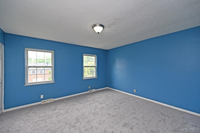 5 Spotswood Cmn, Union Twp, OH 45103 - carpeted empty room featuring baseboards and a textured ceiling