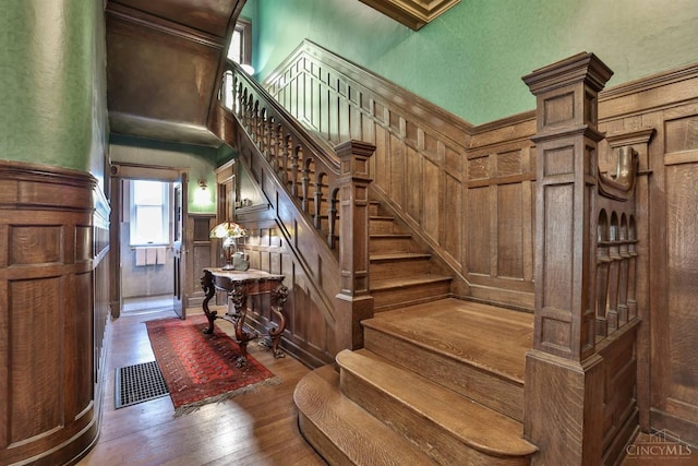 2334 Upland Pl, Cincinnati, OH 45206 - stairs with hardwood / wood-style flooring and a decorative wall