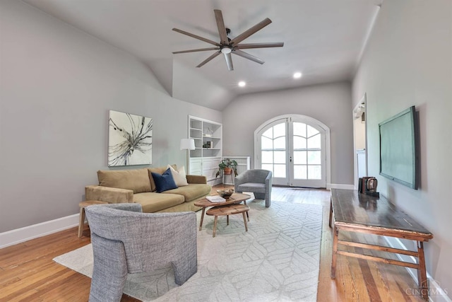 2334 Upland Pl, Cincinnati, OH 45206 - living room with light wood-type flooring, ceiling fan, vaulted ceiling, built in shelves, and french doors