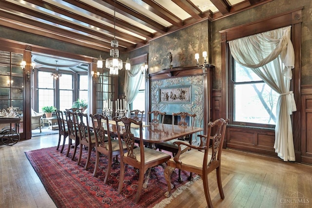 2334 Upland Pl, Cincinnati, OH 45206 - dining area featuring a chandelier, beam ceiling, and hardwood / wood-style floors
