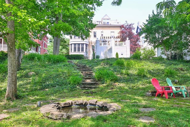 2334 Upland Pl, Cincinnati, OH 45206 - view of yard featuring a fire pit and stairs