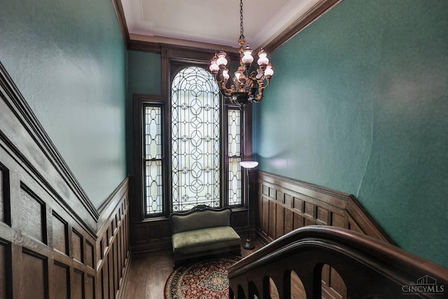 2334 Upland Pl, Cincinnati, OH 45206 - entrance foyer with crown molding, wood finished floors, wainscoting, and a decorative wall