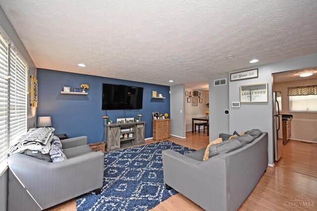 2868 Grosvenor Dr, Colerain Twp, OH 45251 - living area with a textured ceiling, wood finished floors, and recessed lighting