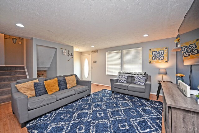 2868 Grosvenor Dr, Colerain Twp, OH 45251 - living area with stairway, a textured ceiling, recessed lighting, wood finished floors, and baseboards