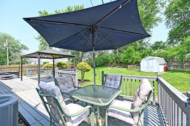 2868 Grosvenor Dr, Colerain Twp, OH 45251 - wooden terrace featuring outdoor dining area, a gazebo, and central AC