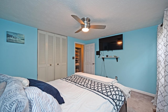 2868 Grosvenor Dr, Colerain Twp, OH 45251 - bedroom featuring a closet, carpet, a ceiling fan, baseboards, and a textured ceiling