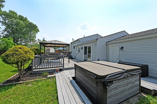 2868 Grosvenor Dr, Colerain Twp, OH 45251 - wooden deck featuring a hot tub, a gazebo, and a lawn