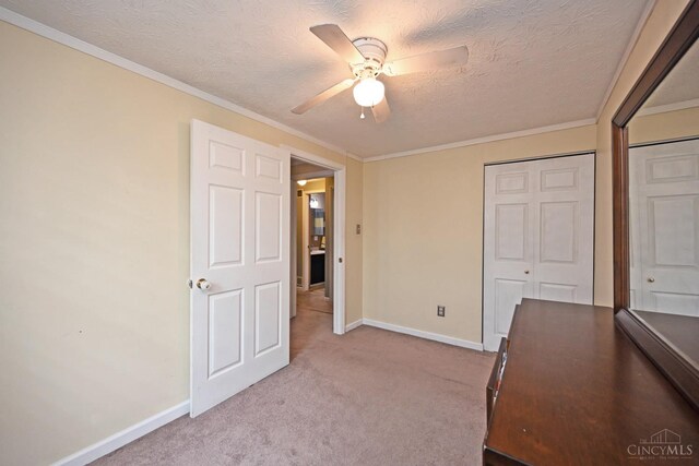 2868 Grosvenor Dr, Colerain Twp, OH 45251 - unfurnished bedroom with baseboards, carpet floors, a closet, a textured ceiling, and ceiling fan