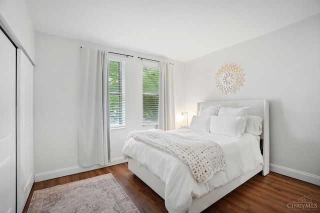 983 Paradrome St Unit A, Cincinnati, OH 45202 - bedroom featuring baseboards, wood finished floors, and a closet