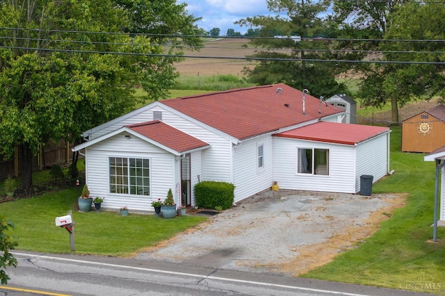 12977 E US Rt 50, Paint Twp, OH 45612 - view of front facade with driveway, a storage shed, and a front yard