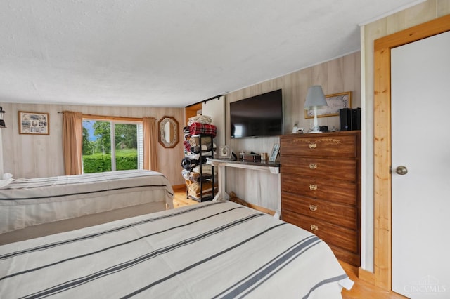 12977 E US Rt 50, Paint Twp, OH 45612 - bedroom featuring wood finished floors and wooden walls