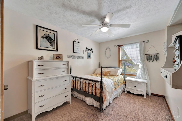 55 Kastrup Dr, Lakengren, OH 45320 - bedroom featuring light colored carpet, a textured ceiling, baseboards, and a ceiling fan