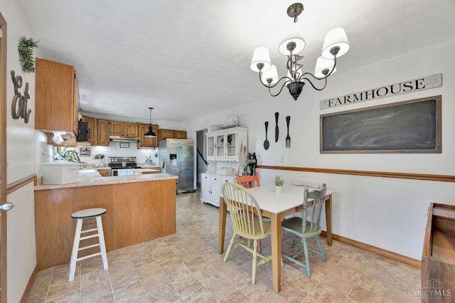 55 Kastrup Dr, Lakengren, OH 45320 - dining area with a chandelier and baseboards