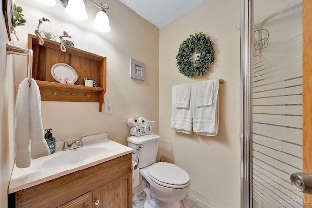 55 Kastrup Dr, Lakengren, OH 45320 - full bathroom featuring vanity, toilet, an enclosed shower, and baseboards