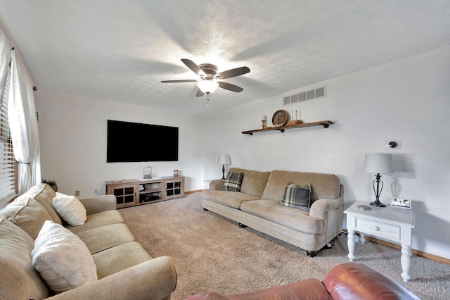 55 Kastrup Dr, Lakengren, OH 45320 - carpeted living room with a ceiling fan, a textured ceiling, and baseboards