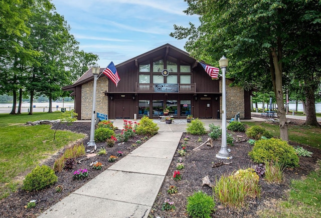 55 Kastrup Dr, Lakengren, OH 45320 - view of front of house with stone siding and a front lawn