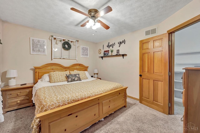 55 Kastrup Dr, Lakengren, OH 45320 - bedroom featuring light carpet, a textured ceiling, and ceiling fan