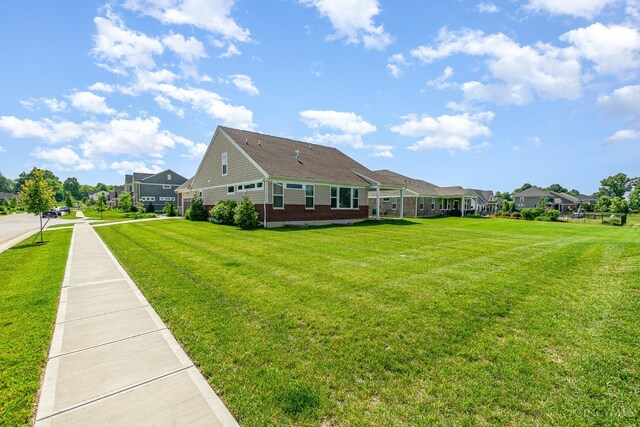 3779 Sturbridge Way, Pierce Twp, OH 45245 - view of property exterior with brick siding, a yard, and a residential view