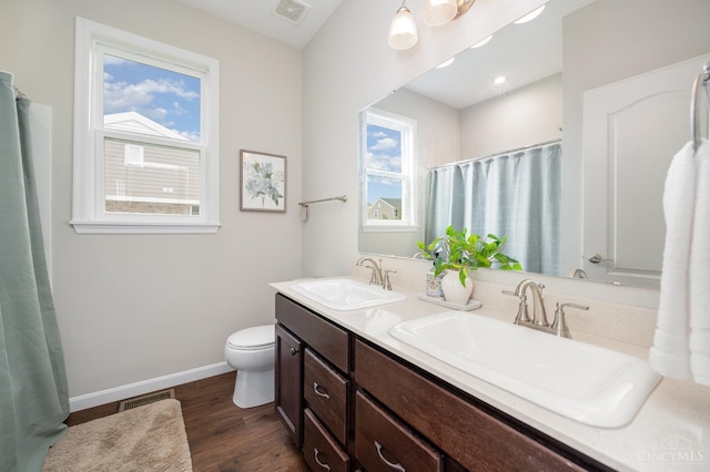 3779 Sturbridge Way, Pierce Twp, OH 45245 - full bath with healthy amount of natural light, toilet, double vanity, and wood finished floors