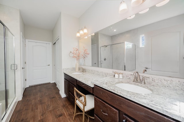 3779 Sturbridge Way, Pierce Twp, OH 45245 - bathroom featuring a shower stall, double vanity, and wood finished floors