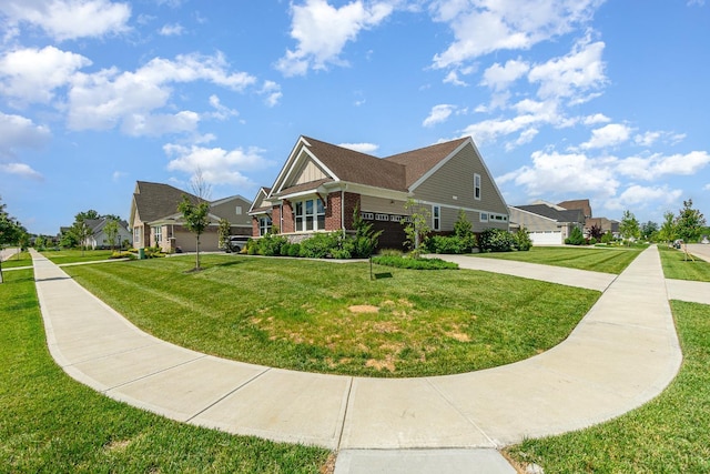3779 Sturbridge Way, Pierce Twp, OH 45245 - view of front of home with driveway, a garage, brick siding, and a front yard