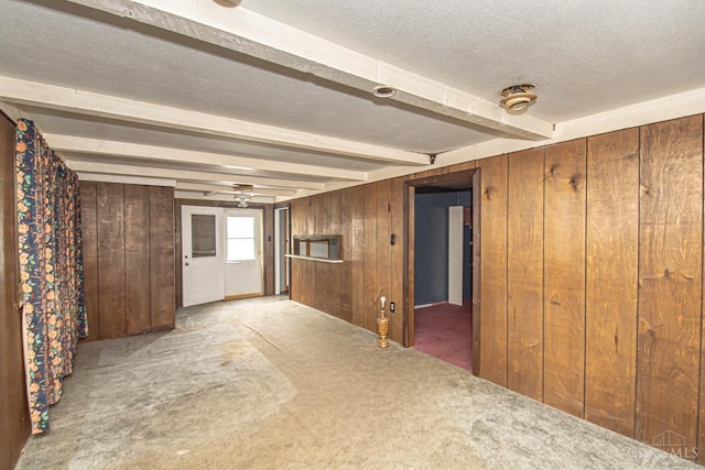 800 Richardson Dr, Middletown, OH 45042 - unfurnished room featuring carpet flooring, beamed ceiling, wood walls, a textured ceiling, and a ceiling fan