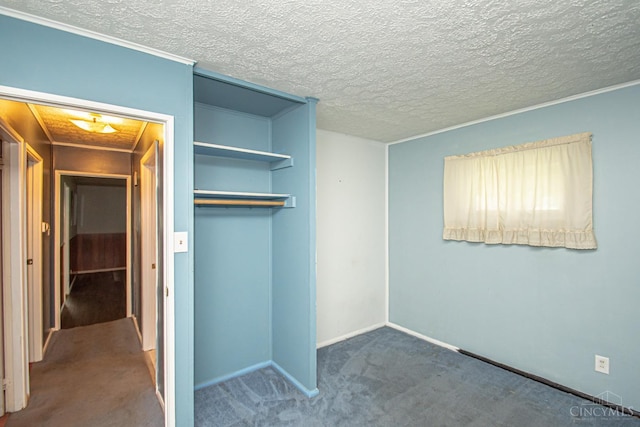 800 Richardson Dr, Middletown, OH 45042 - unfurnished bedroom featuring a closet, carpet floors, baseboards, and a textured ceiling