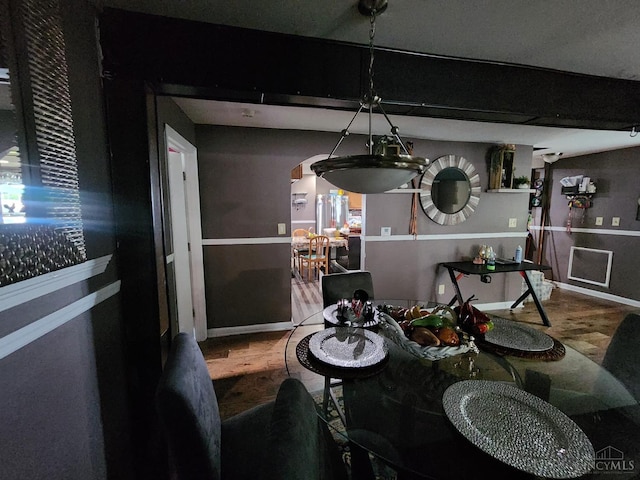 223 Park St, Middletown, OH 45044 - dining area featuring arched walkways, baseboards, and wood finished floors