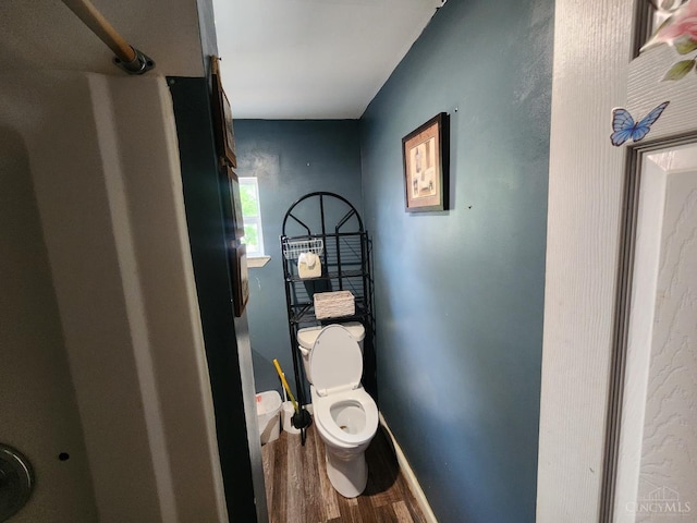 223 Park St, Middletown, OH 45044 - bathroom with wood finished floors, toilet, and baseboards