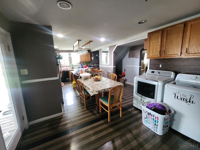 223 Park St, Middletown, OH 45044 - dining room with washer and dryer, dark wood-style floors, baseboards, recessed lighting, and a chandelier