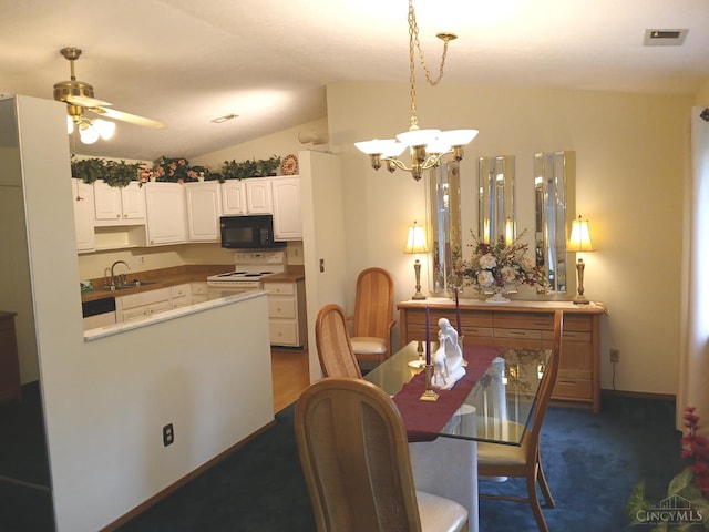 5292 Eaglesnest Dr Unit 41, Green Twp, OH 45248 - dining space with a chandelier, vaulted ceiling, dark colored carpet, and a ceiling fan