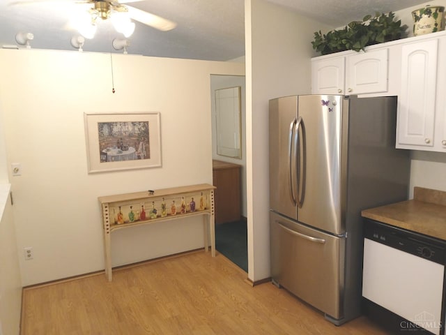 5292 Eaglesnest Dr Unit 41, Green Twp, OH 45248 - kitchen featuring dishwasher, light wood finished floors, ceiling fan, white cabinetry, and freestanding refrigerator