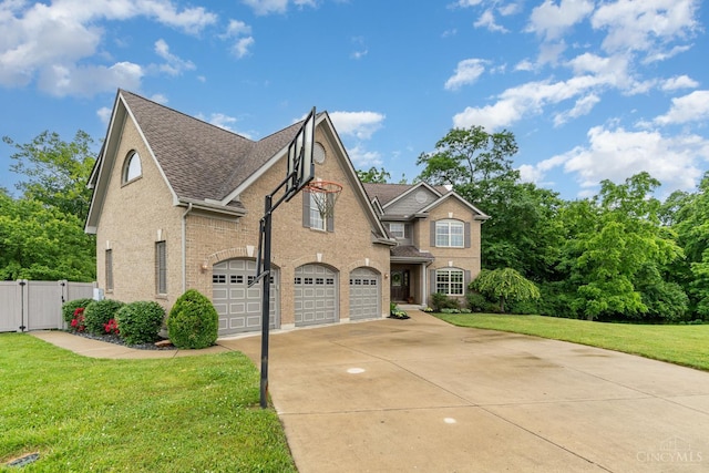 3190 Fox Run Dr, Ross Twp, OH 45013 - view of front of property featuring a garage, driveway, a gate, brick siding, and roof with shingles