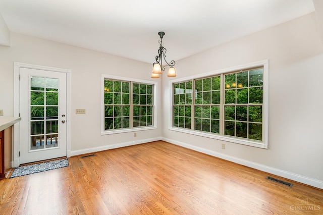 3190 Fox Run Dr, Ross Twp, OH 45013 - unfurnished dining area featuring a chandelier and light wood-style floors