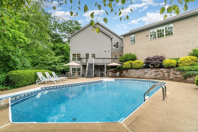 3190 Fox Run Dr, Ross Twp, OH 45013 - outdoor pool featuring stairs, a wooden deck, and a patio