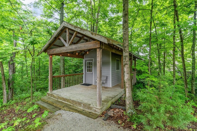 3190 Fox Run Dr, Ross Twp, OH 45013 - deck featuring a wooded view and an outdoor structure