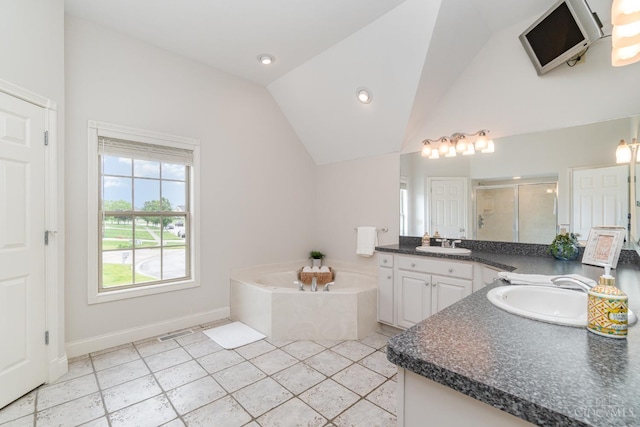 3190 Fox Run Dr, Ross Twp, OH 45013 - full bath with lofted ceiling, two vanities, a garden tub, a stall shower, and tile patterned flooring