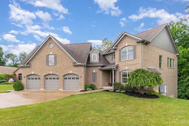 3190 Fox Run Dr, Ross Twp, OH 45013 - traditional home with driveway, a garage, brick siding, and a front yard