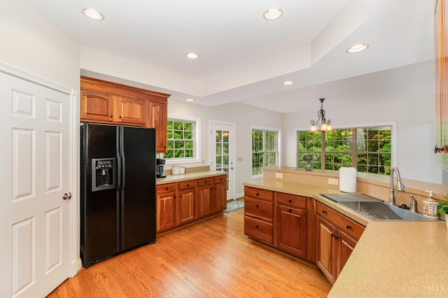 3190 Fox Run Dr, Ross Twp, OH 45013 - kitchen with black refrigerator with ice dispenser, brown cabinetry, light countertops, and recessed lighting