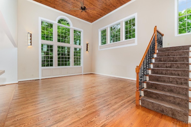 3190 Fox Run Dr, Ross Twp, OH 45013 - unfurnished living room with wood finished floors, ornamental molding, healthy amount of natural light, wood ceiling, and stairs