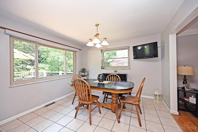 3430 Melodymanor Dr, Colerain Twp, OH 45239 - dining space with a chandelier and light tile patterned flooring