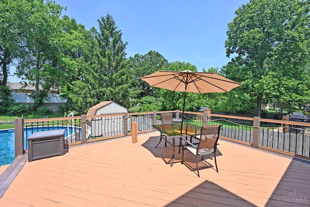 3430 Melodymanor Dr, Colerain Twp, OH 45239 - deck with outdoor dining space and a storage unit