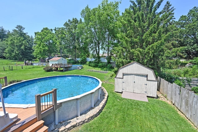 3430 Melodymanor Dr, Colerain Twp, OH 45239 - view of pool featuring a storage unit, a fenced backyard, and a deck