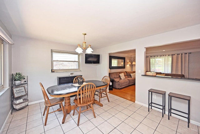3430 Melodymanor Dr, Colerain Twp, OH 45239 - dining room with a chandelier and light tile patterned floors