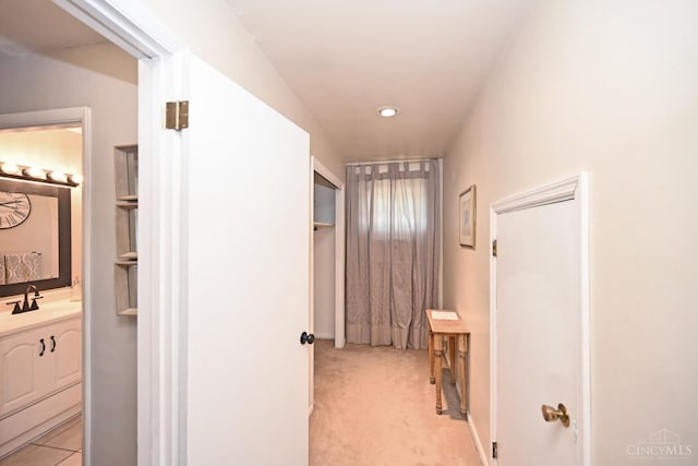 3430 Melodymanor Dr, Colerain Twp, OH 45239 - hallway featuring light colored carpet and a sink