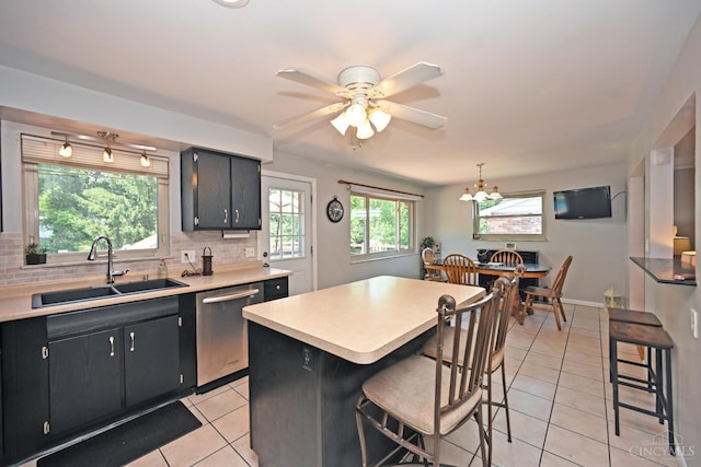 3430 Melodymanor Dr, Colerain Twp, OH 45239 - kitchen with dishwasher, light tile patterned floors, light countertops, and tasteful backsplash
